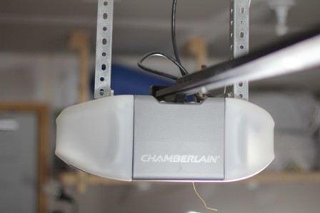 A Chamberlain garage door opener mounted on the ceiling